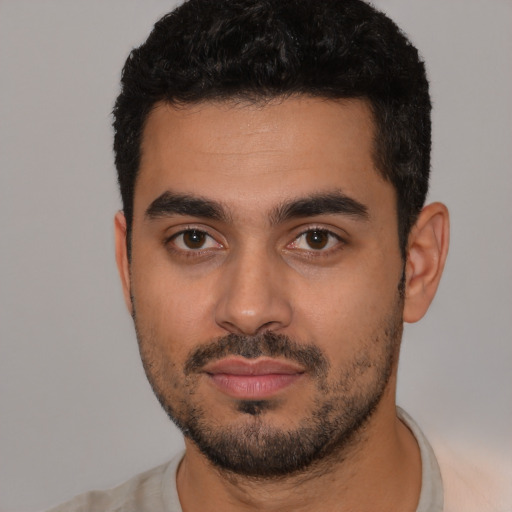 Neutral latino young-adult male with short  black hair and brown eyes