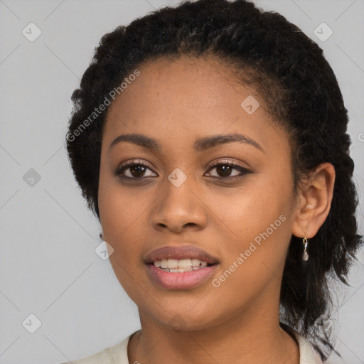 Joyful black young-adult female with long  black hair and brown eyes