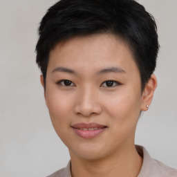 Joyful asian young-adult female with short  black hair and brown eyes