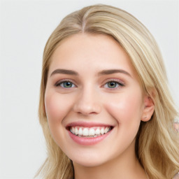 Joyful white young-adult female with long  brown hair and blue eyes