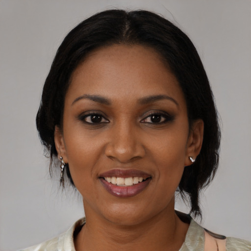 Joyful black young-adult female with medium  black hair and brown eyes