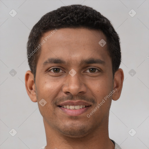 Joyful latino young-adult male with short  brown hair and brown eyes
