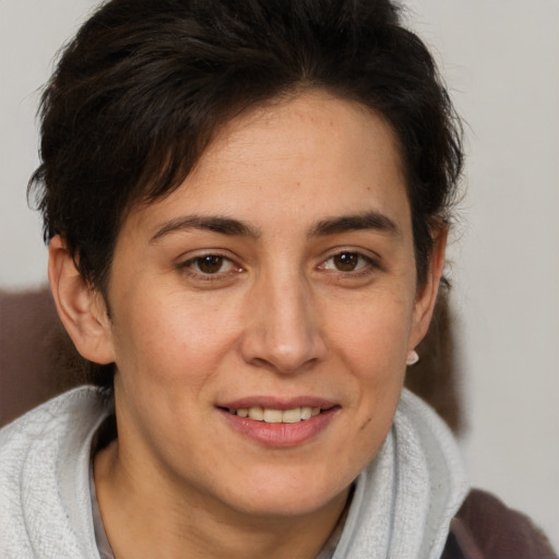 Joyful white adult female with short  brown hair and brown eyes