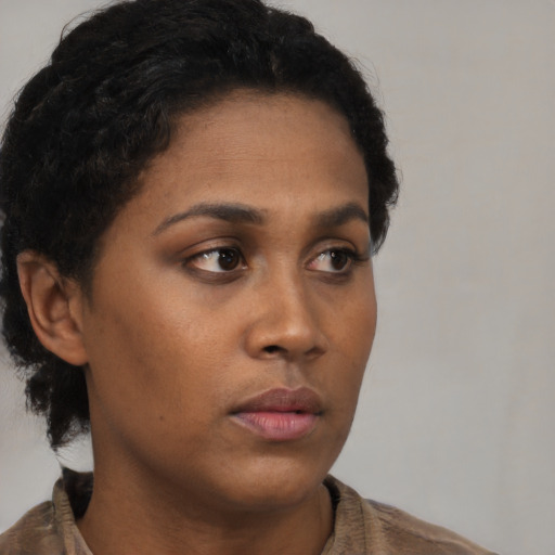 Neutral black young-adult female with short  brown hair and brown eyes