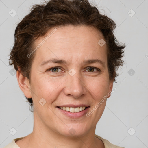 Joyful white adult female with short  brown hair and grey eyes