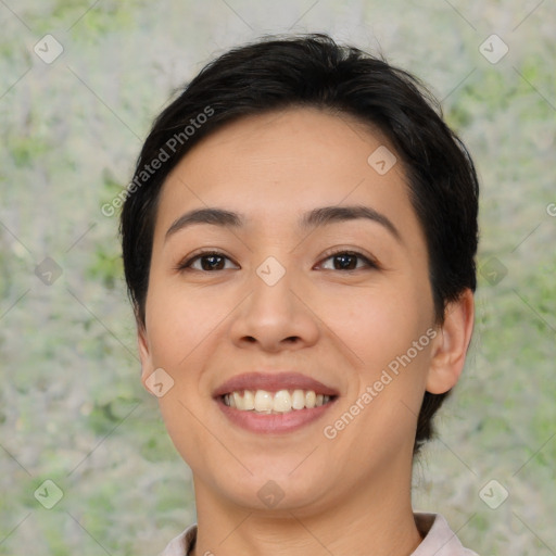 Joyful asian young-adult female with medium  black hair and brown eyes