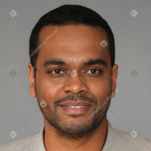 Joyful black young-adult male with short  black hair and brown eyes