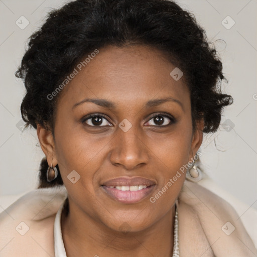 Joyful black adult female with long  brown hair and brown eyes