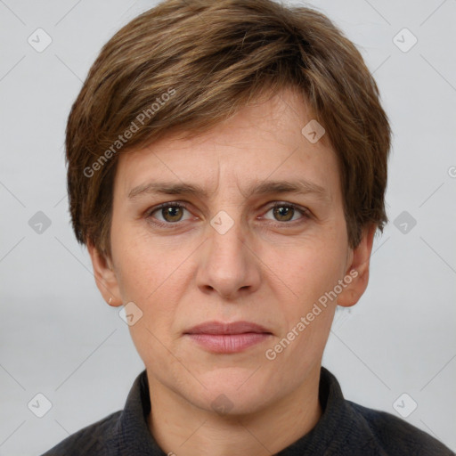 Joyful white adult male with short  brown hair and grey eyes