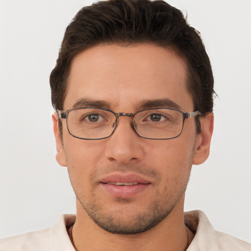 Joyful white young-adult male with short  brown hair and brown eyes