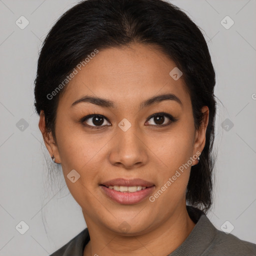 Joyful latino young-adult female with medium  brown hair and brown eyes