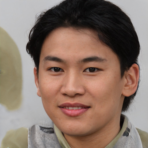 Joyful asian young-adult female with short  brown hair and brown eyes