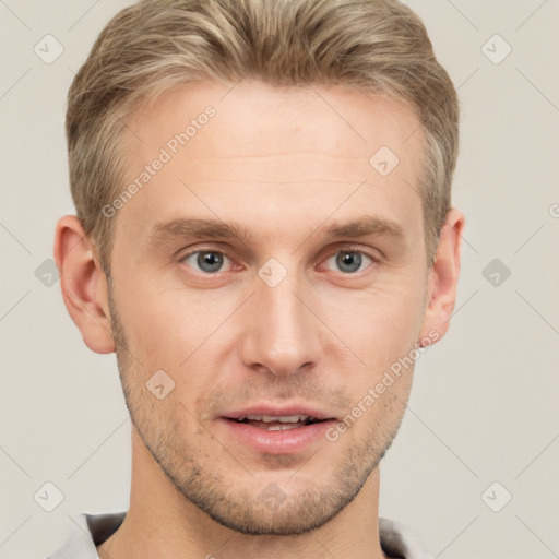 Joyful white young-adult male with short  brown hair and grey eyes