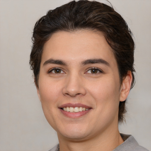 Joyful white young-adult female with medium  brown hair and brown eyes