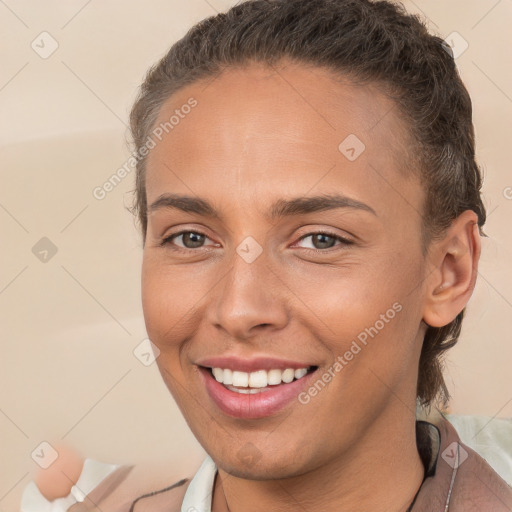 Joyful white young-adult female with short  brown hair and brown eyes