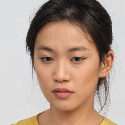 Neutral asian young-adult female with medium  brown hair and brown eyes