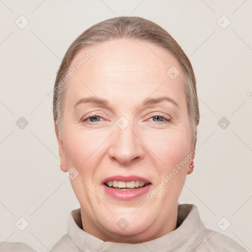 Joyful white adult female with short  brown hair and grey eyes