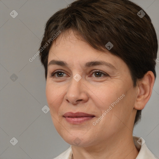 Joyful white adult female with short  brown hair and brown eyes