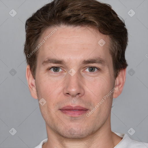 Joyful white adult male with short  brown hair and grey eyes