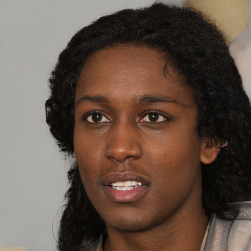Neutral black young-adult female with short  black hair and brown eyes