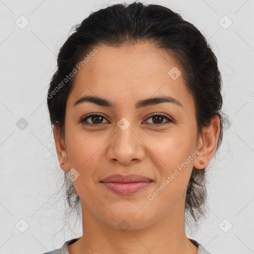 Joyful latino young-adult female with medium  brown hair and brown eyes