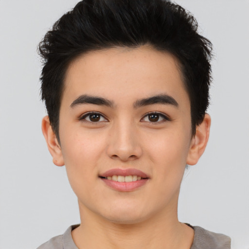 Joyful asian young-adult male with short  black hair and brown eyes