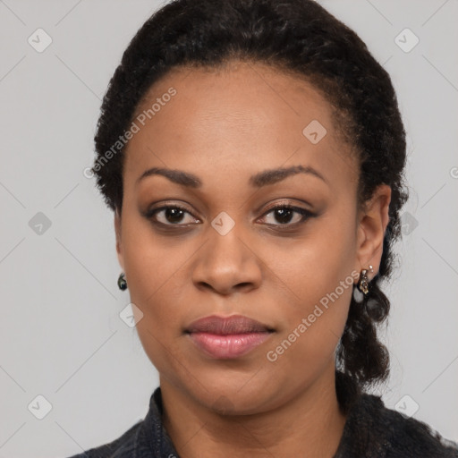 Joyful black young-adult female with long  black hair and brown eyes