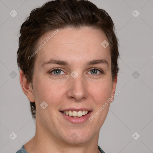 Joyful white young-adult female with short  brown hair and grey eyes