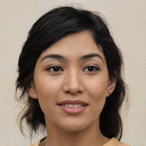 Joyful white young-adult female with medium  black hair and brown eyes