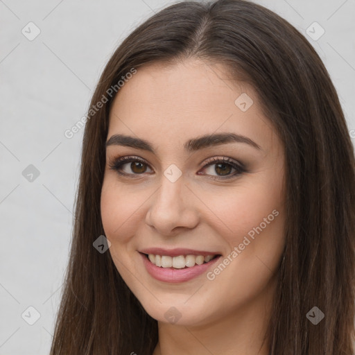 Joyful white young-adult female with long  brown hair and brown eyes