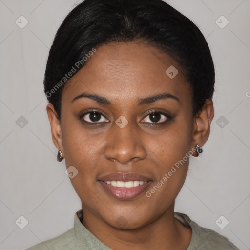 Joyful black young-adult female with short  black hair and brown eyes