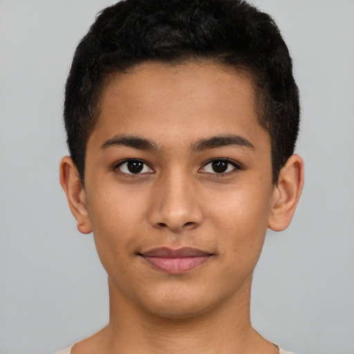 Joyful latino young-adult male with short  brown hair and brown eyes