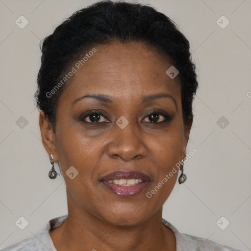 Joyful black adult female with short  brown hair and brown eyes