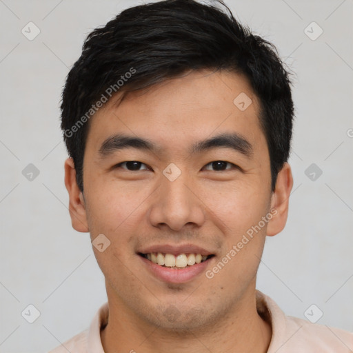 Joyful asian young-adult male with short  black hair and brown eyes