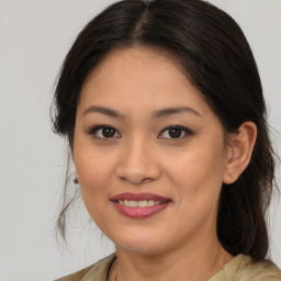 Joyful white young-adult female with medium  brown hair and brown eyes