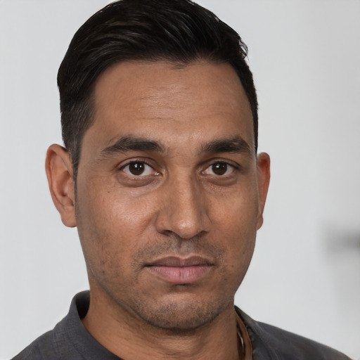 Neutral white young-adult male with short  black hair and brown eyes