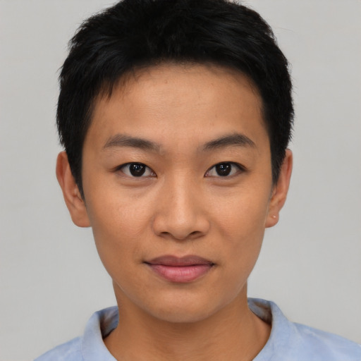 Joyful asian young-adult male with short  black hair and brown eyes