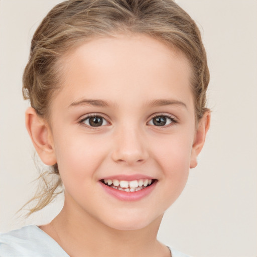 Joyful white child female with medium  brown hair and brown eyes