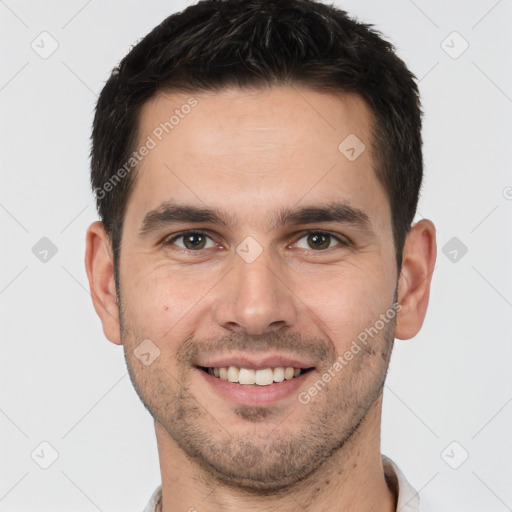 Joyful white young-adult male with short  brown hair and brown eyes