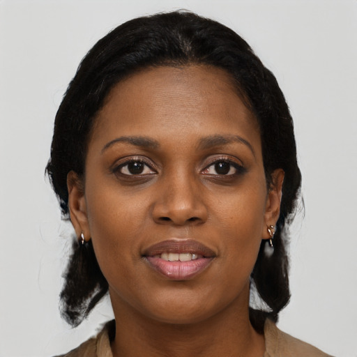 Joyful black young-adult female with medium  brown hair and brown eyes