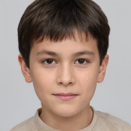 Joyful white child male with short  brown hair and brown eyes