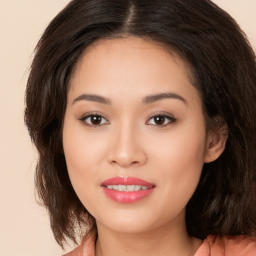 Joyful white young-adult female with medium  brown hair and brown eyes