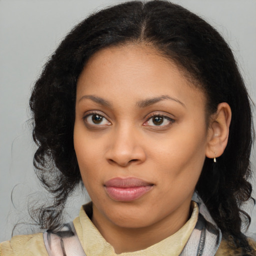 Joyful black young-adult female with medium  brown hair and brown eyes