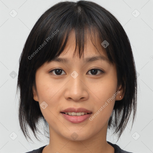 Joyful asian young-adult female with medium  brown hair and brown eyes