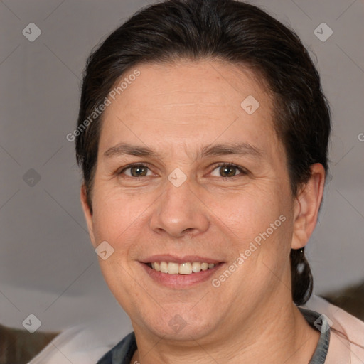 Joyful white adult female with short  brown hair and brown eyes