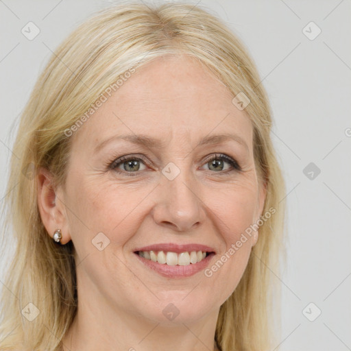 Joyful white adult female with long  brown hair and brown eyes