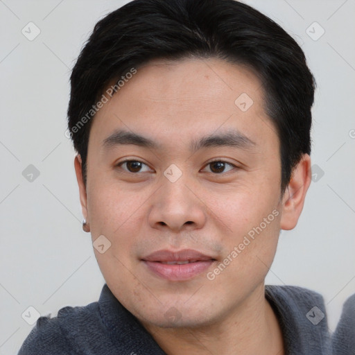 Joyful white young-adult male with short  black hair and brown eyes