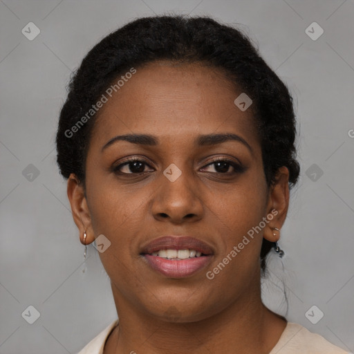 Joyful black young-adult female with short  brown hair and brown eyes