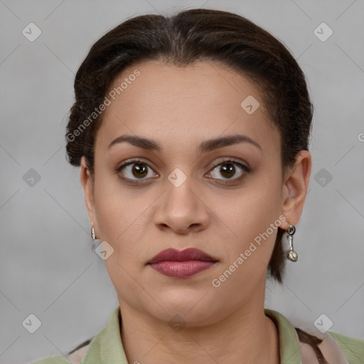 Joyful latino young-adult female with short  brown hair and brown eyes