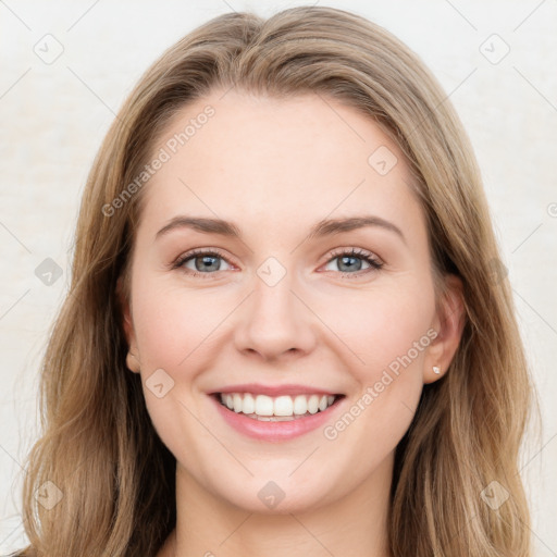 Joyful white young-adult female with long  brown hair and green eyes